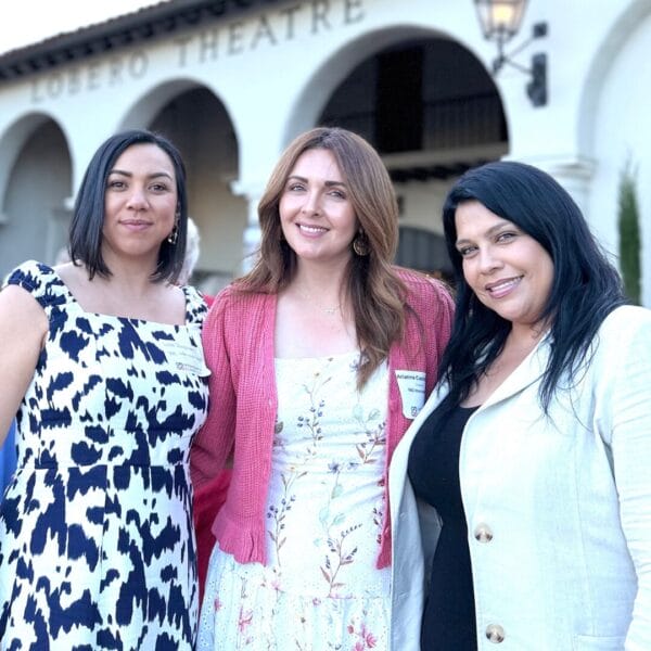 Three staff members from SEE International stand side by side.