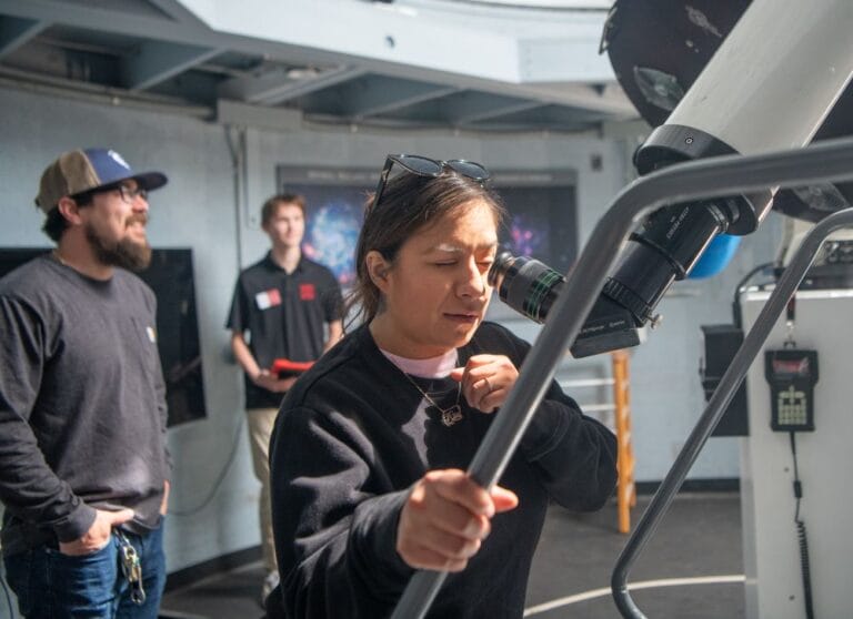 A-Museum-guest-takes-a-safe-peek-at-the-Sun-through-a-telescope-in-Palmer-Observatory
