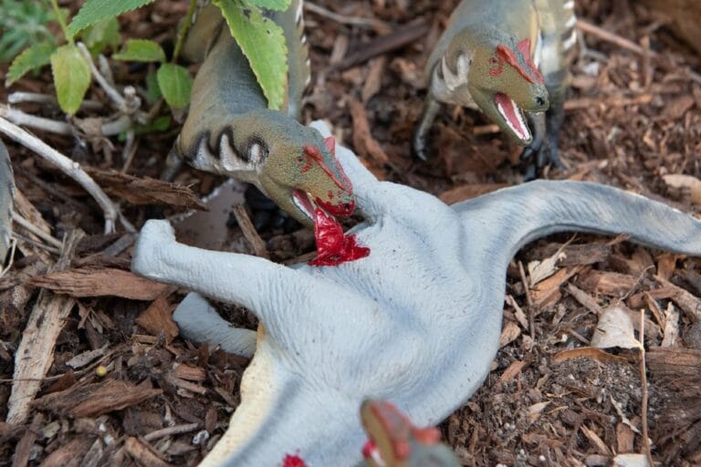 A-pack-of-hungry-therapods-feed-on-a-downed-sauropod-in-Dinorama-Miniatures-Through-the-Mesozoic